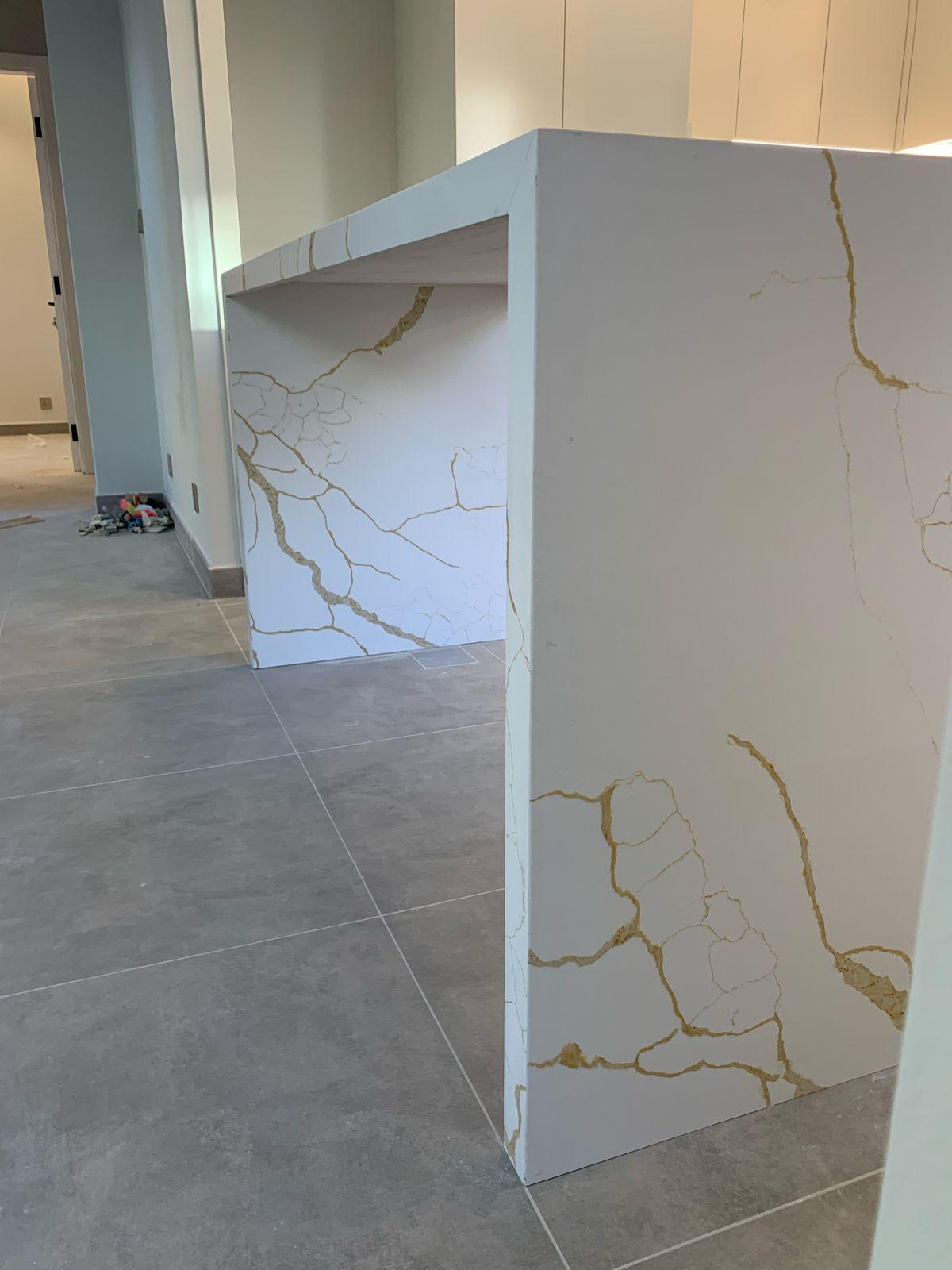 Kitchen Renovation Dubai 7 Close-up of Calacatta marble island — gold veining detail