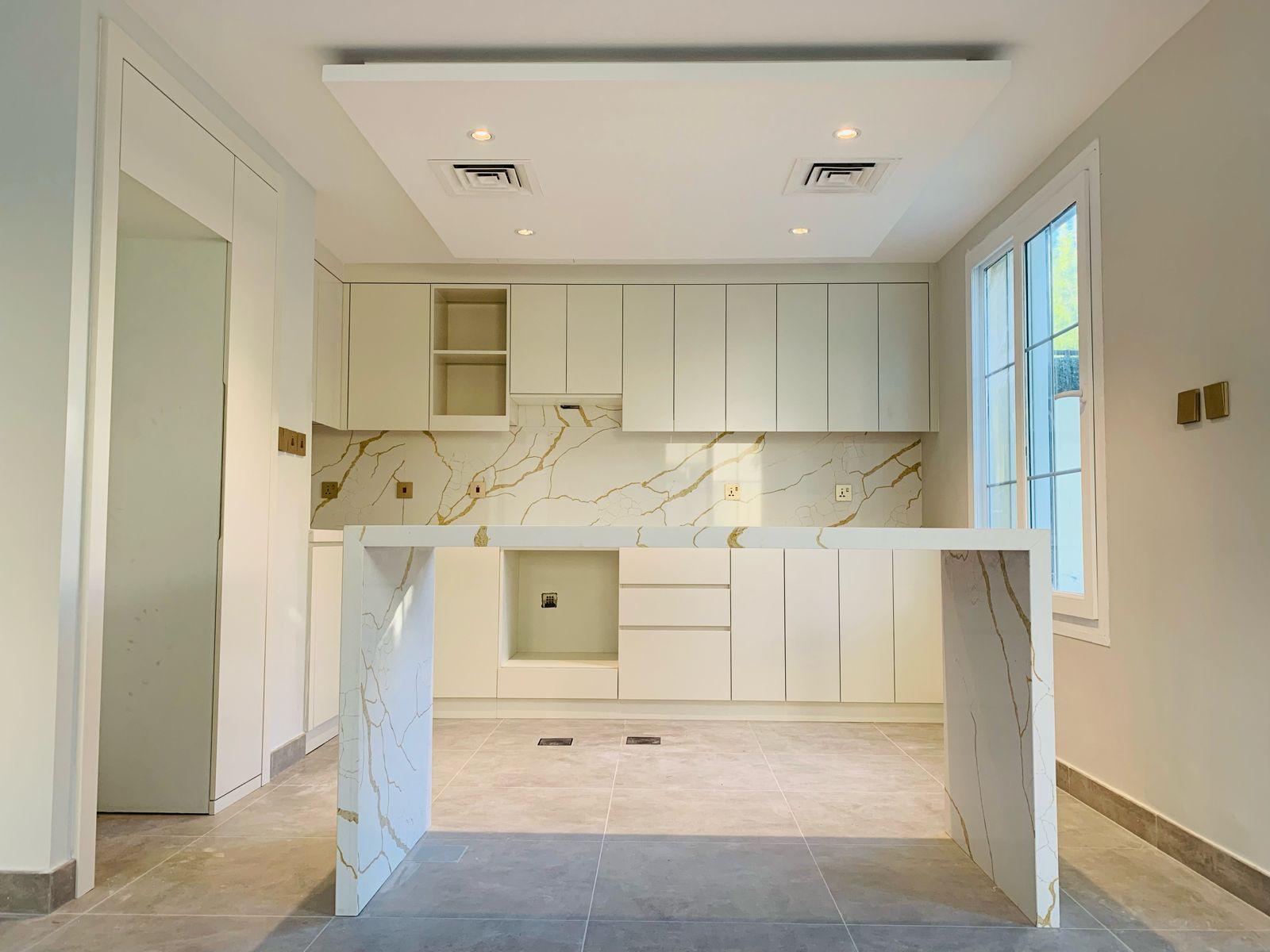 Kitchen cabinetry and island frontal view — PU painted finish