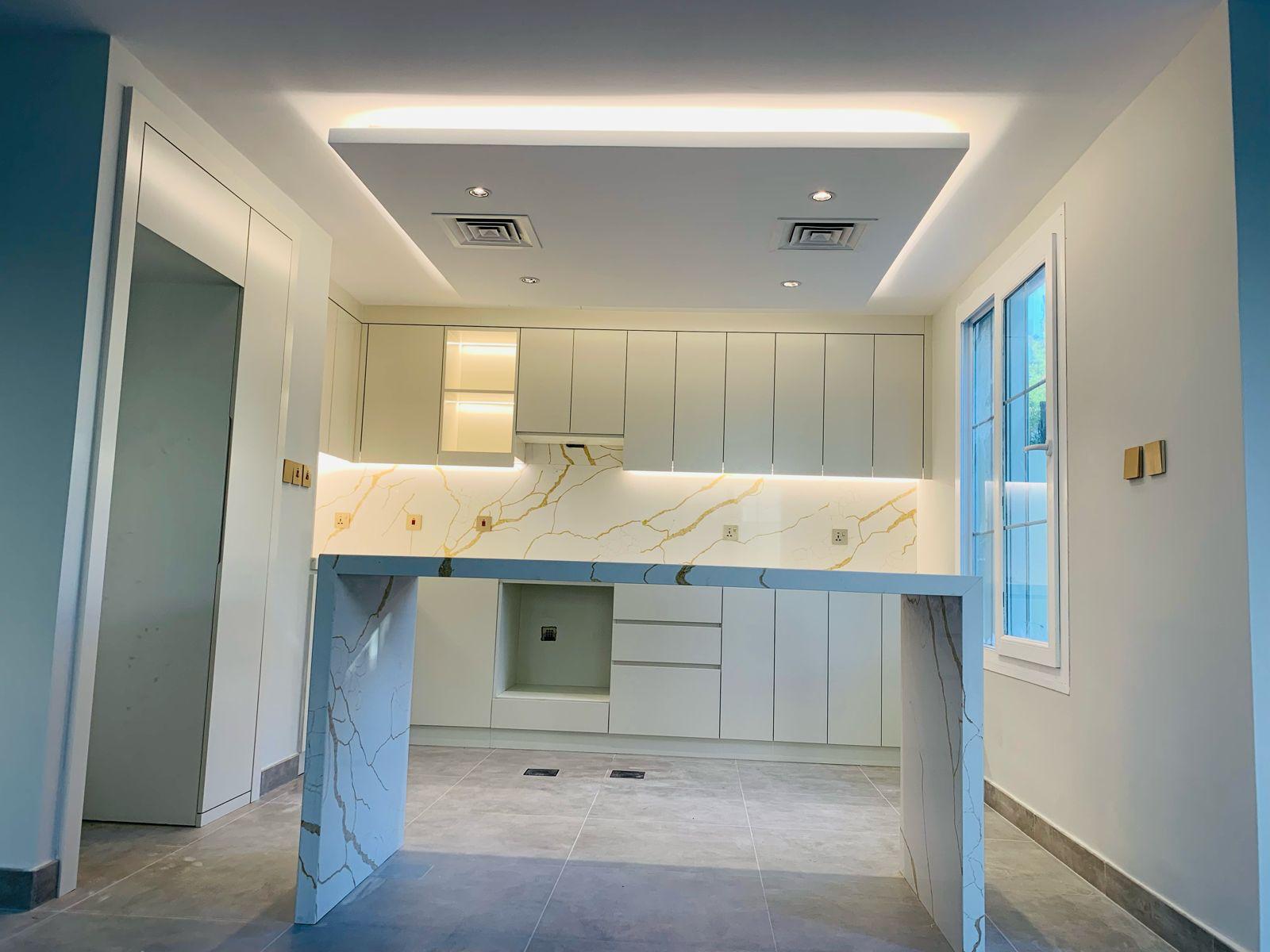 Kitchen LED ceiling cove and recessed lighting detail
