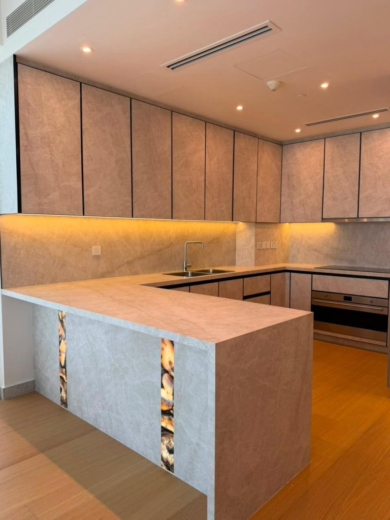 Kitchen with ceiling detail at Canal Front CF09A by ASM Interiors Dubai