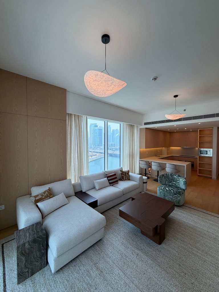 Home 17 Canal Front apartment living room with marina view and open-plan kitchen