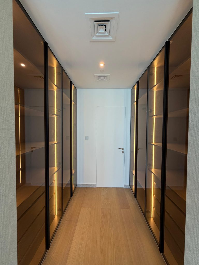 Illuminated custom wardrobe corridor at Canal Front CF09A