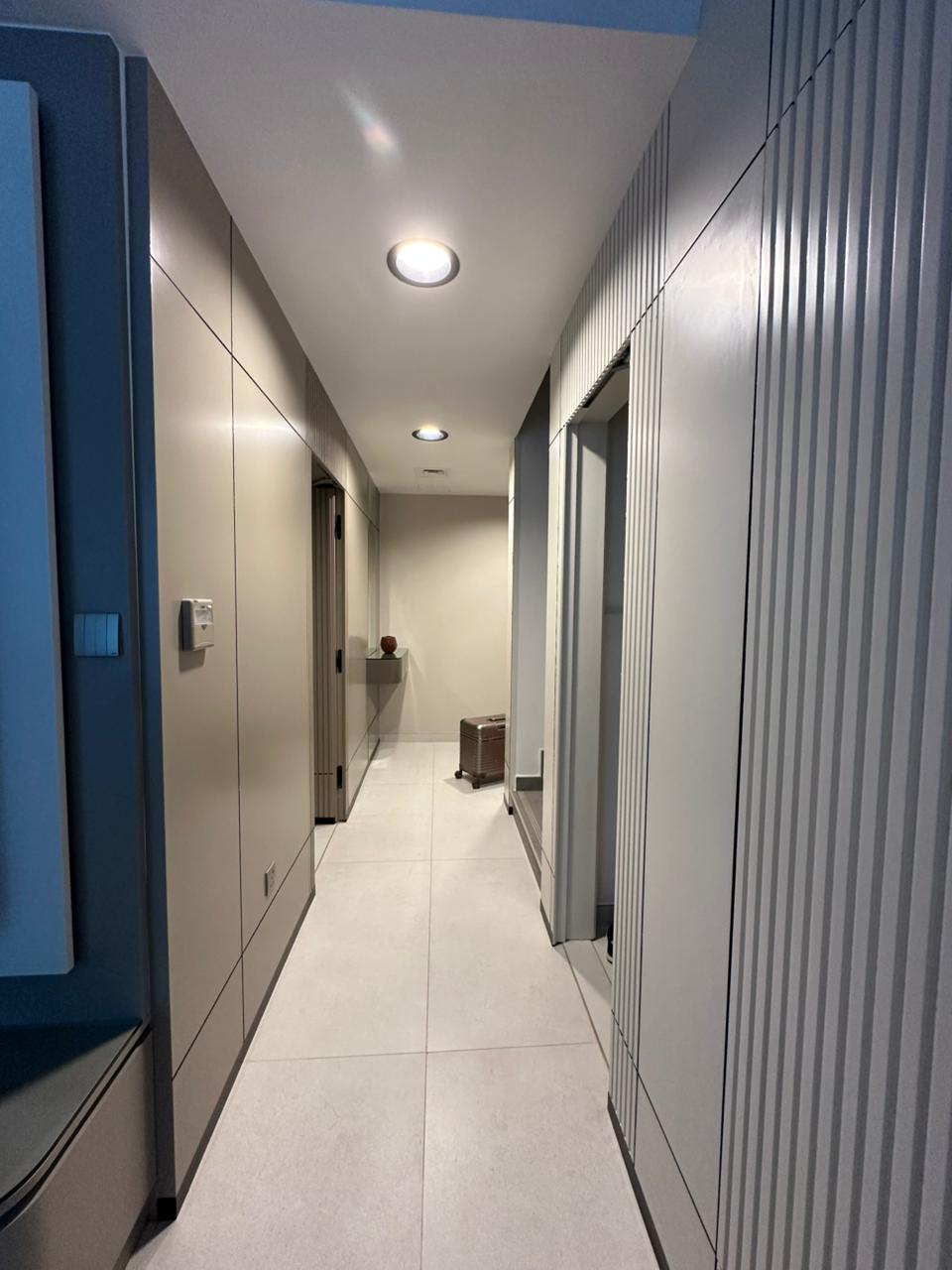 Projects We Have Done 81 Custom wardrobe corridor with fluted-panel detailing for a private villa in Dubai by ASM Interiors