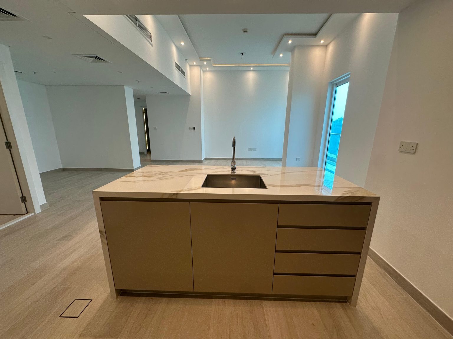 Paloma Tower, Marina Promenade – Apartment Renovation Project 4 Kitchen island with stone worktop, undermount sink, drawers and cupboards, Paloma Tower, Dubai Marina