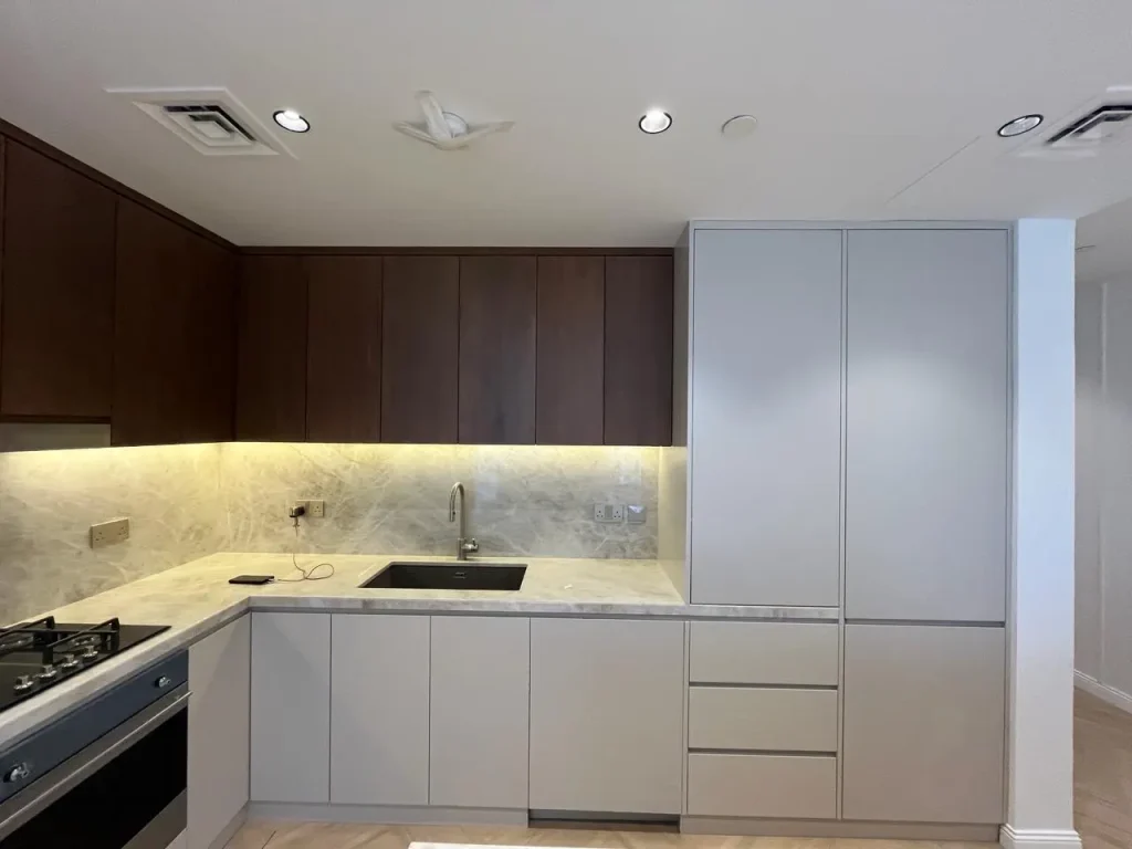 Two-tone kitchen cabinetry at Opera Grand apartment