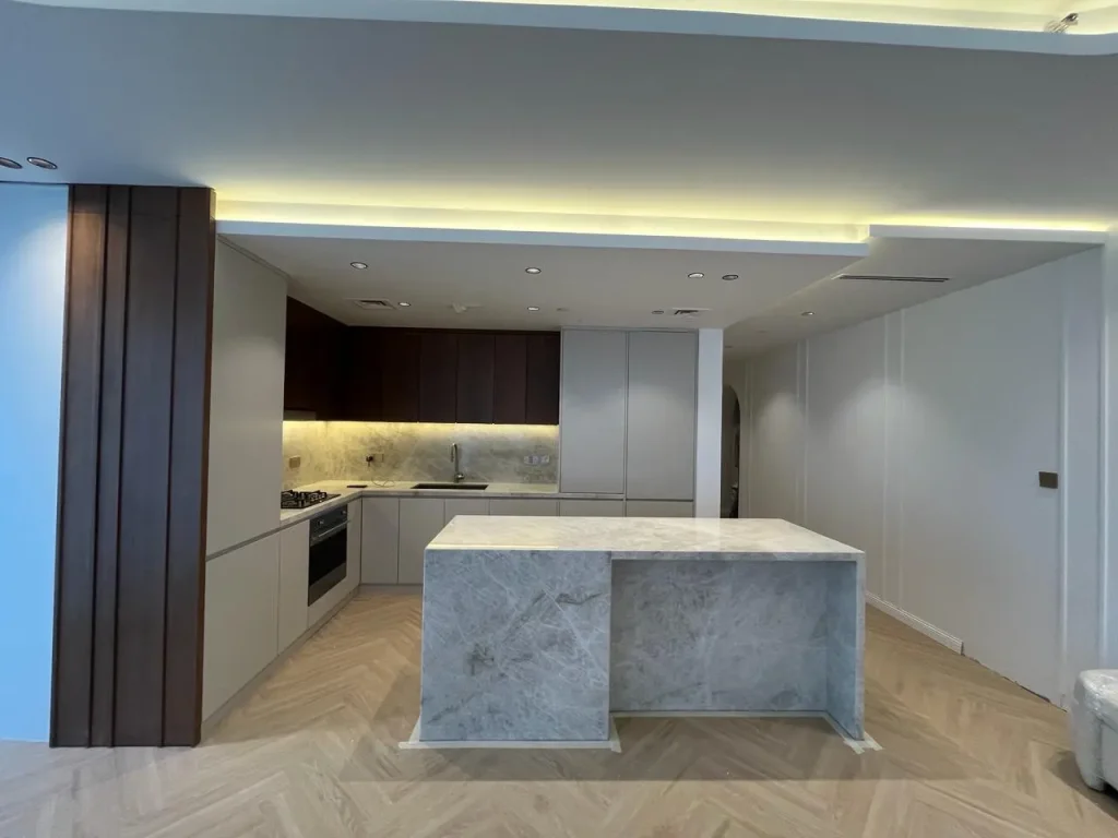 Kitchen island and cabinetry at Opera Grand apartment in Downtown Dubai