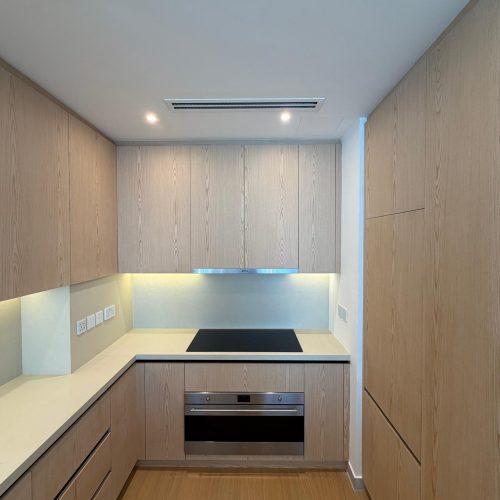 Custom kitchen cabinetry and cooktop wall at Canal Front CF09A