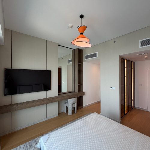 Bedroom TV wall and fitted wardrobe at Canal Front CF09A